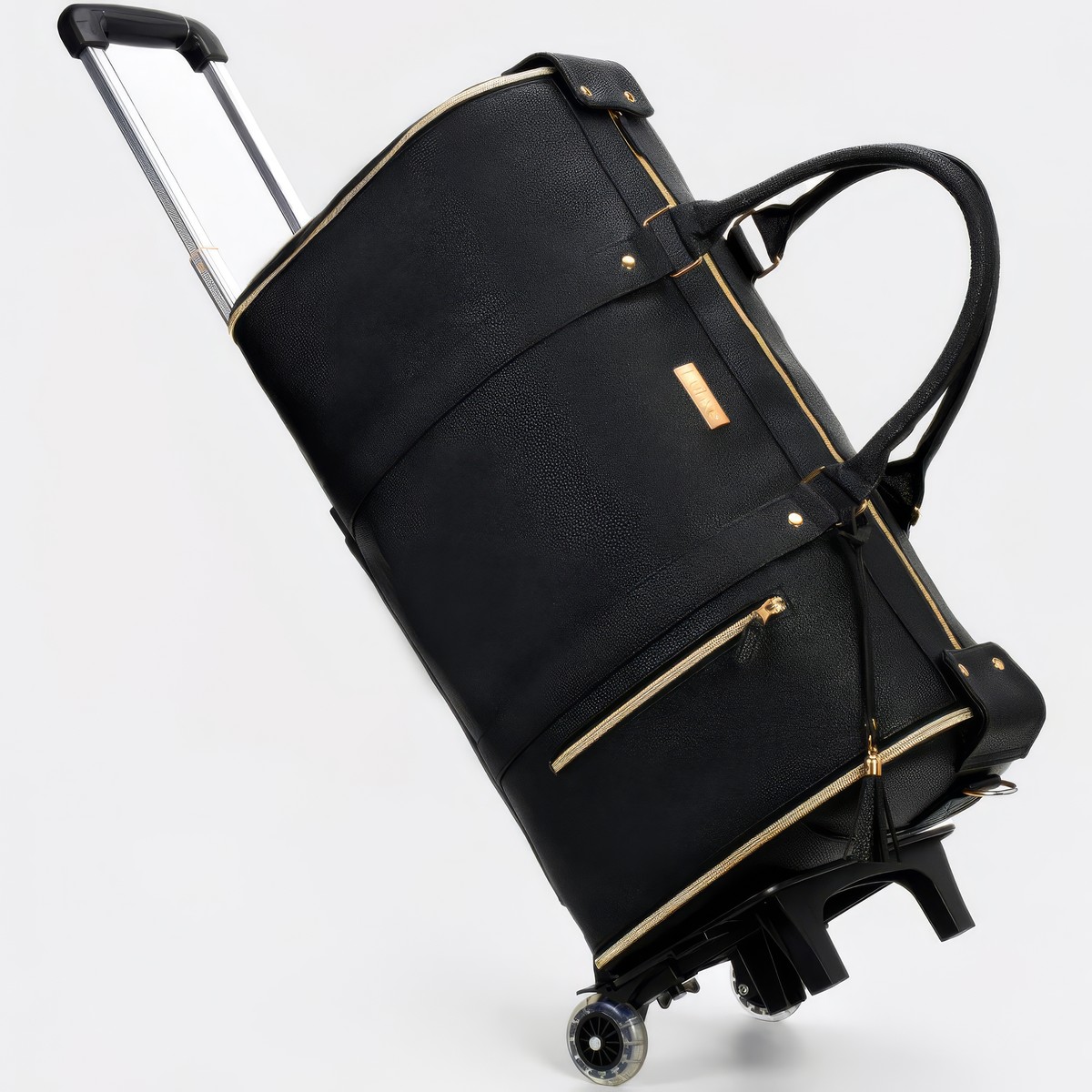 The charcoal Luhxe travel bag standing upright with its telescopic handle